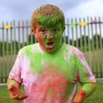 This young boy got covered in paint!