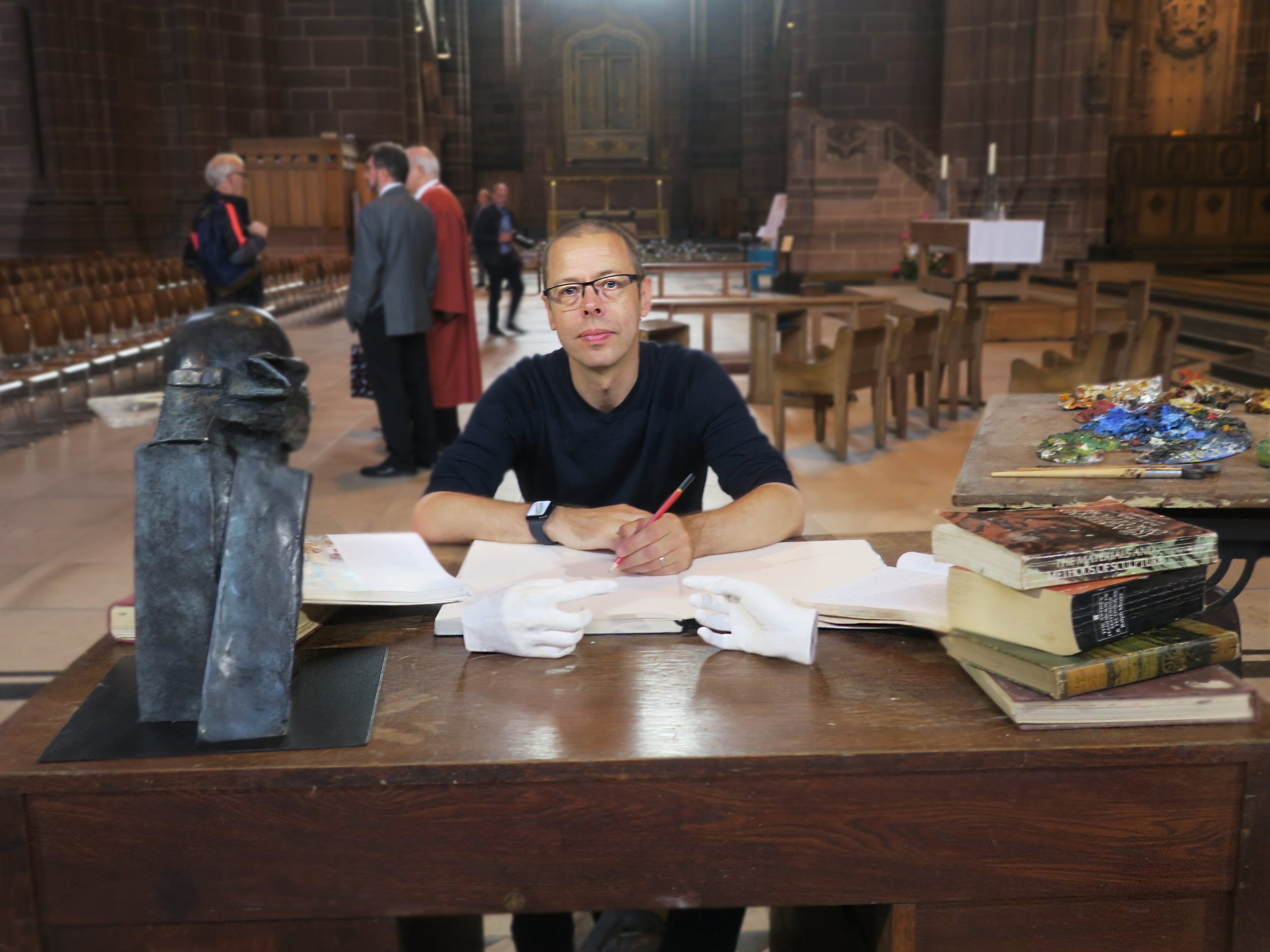 Peter sitting at his work table, part of 'Creativity'