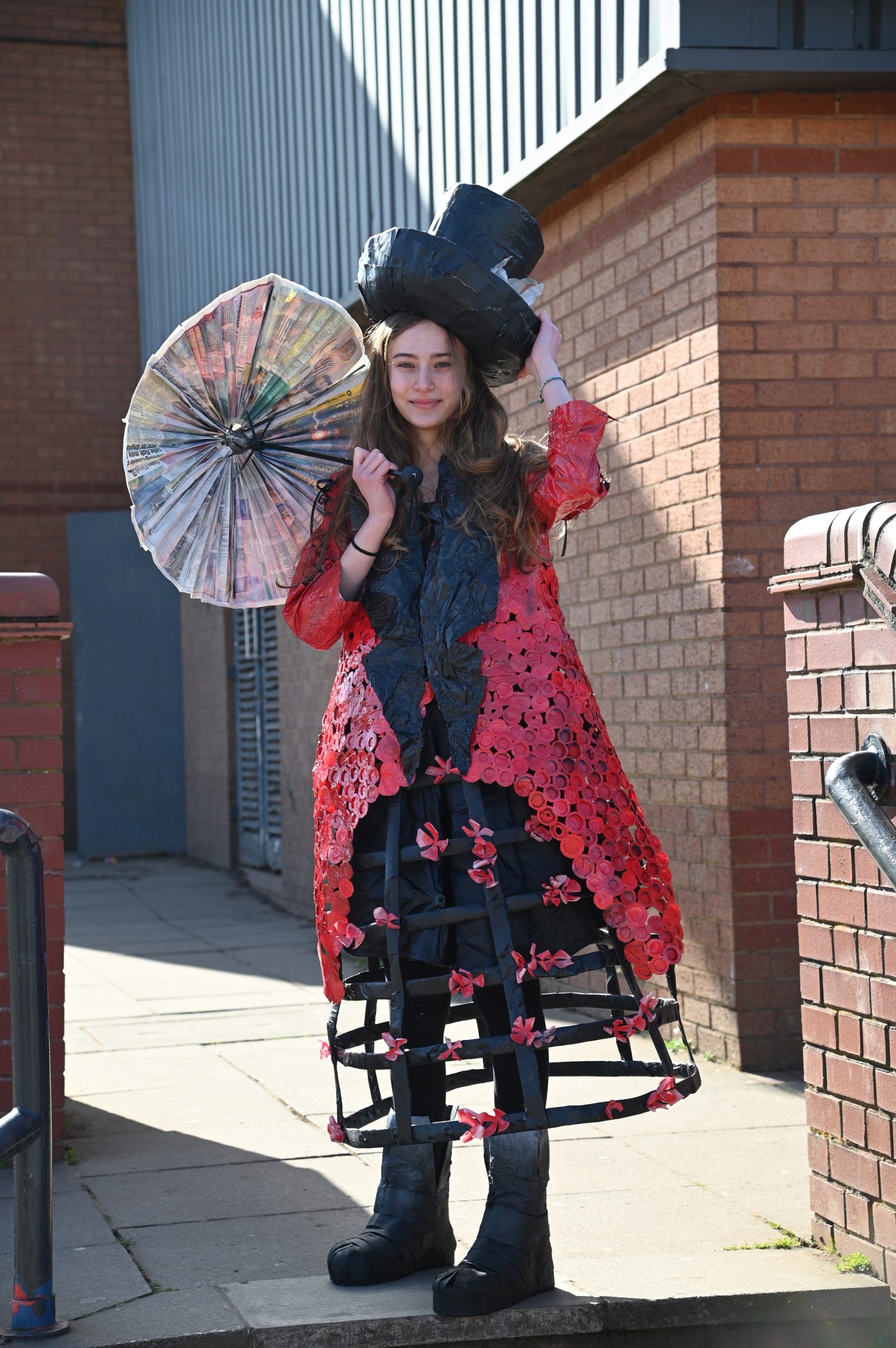 Giuliana with her Junk Kouture creation. Hat, dress, umbrella and shoes are all made out of waste.