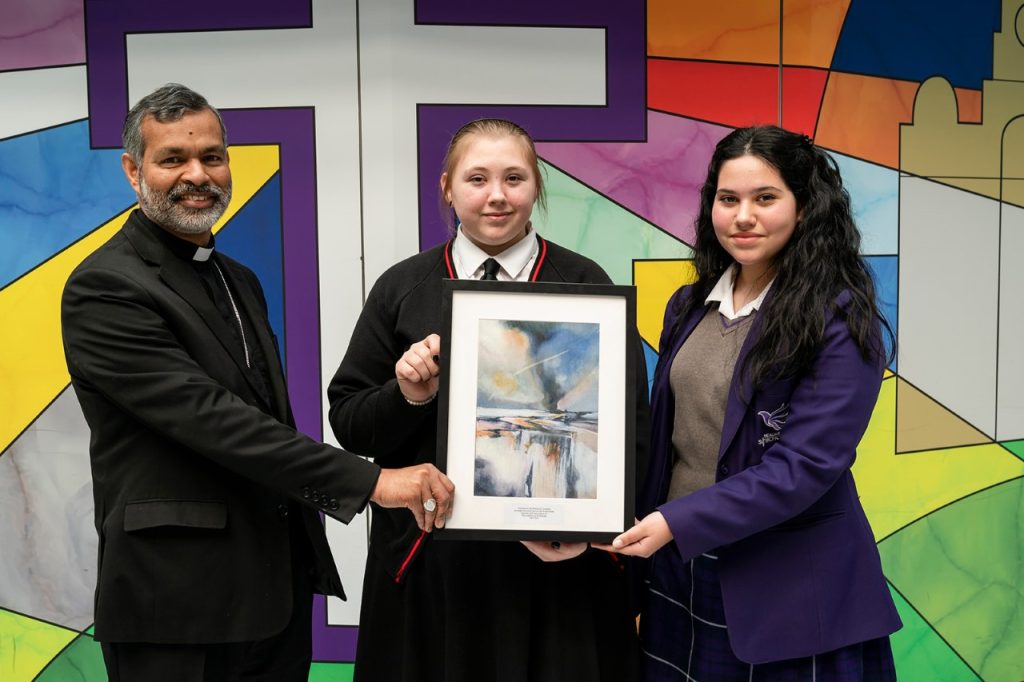 The Bishop of Liverpool was presented with framed artwork created by a Year 11 student