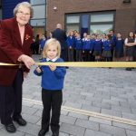 The school’s youngest pupil, 4-year-old James Fearns, cut the ribbon