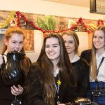Sixth form students offer coffee with a smile
