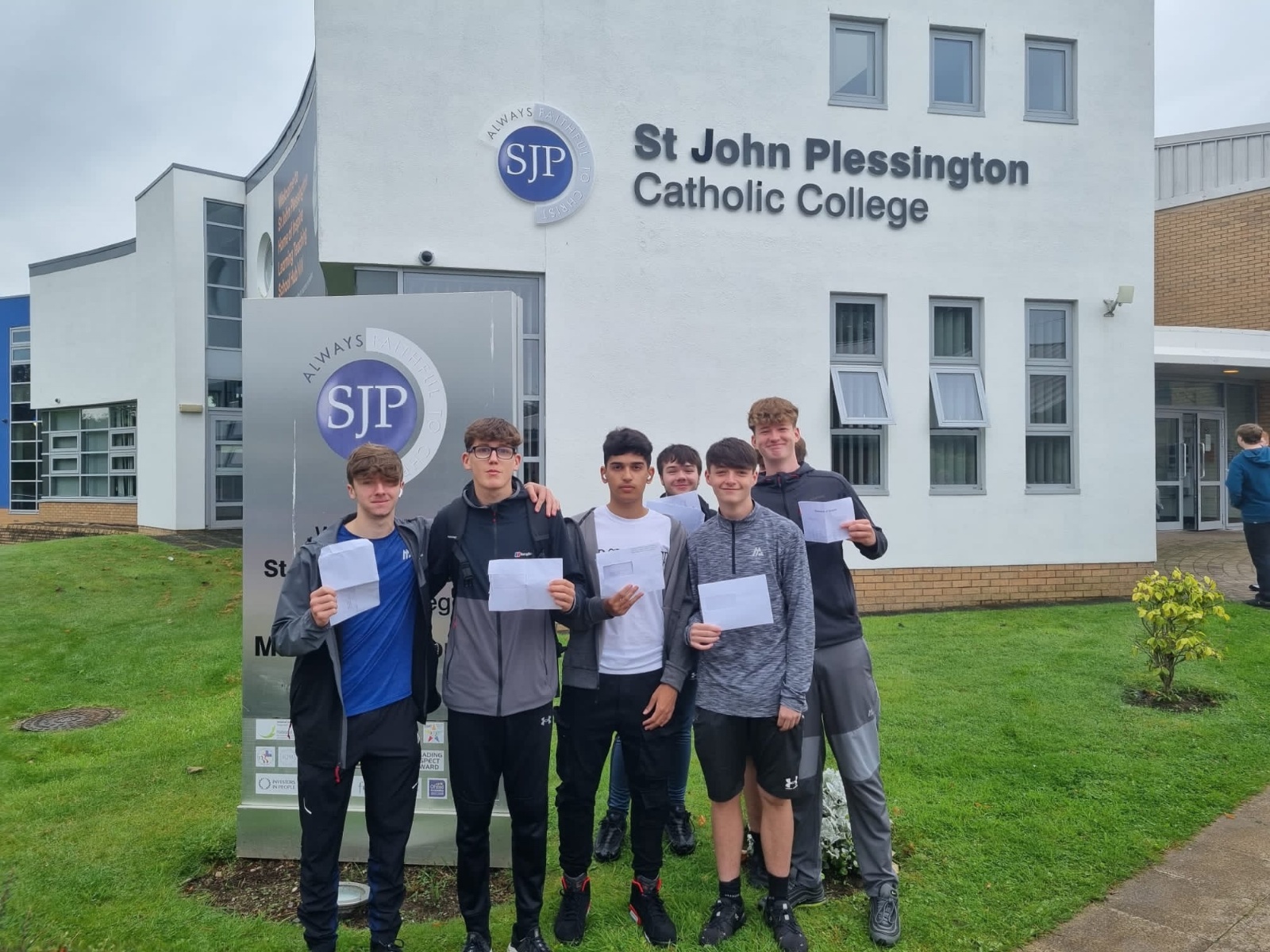 A group of St John Plessington students celebrating their results