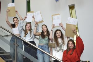 Students from St Julie's Catholic High School proudly show their GCSE results