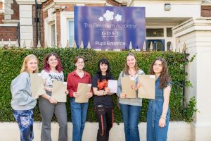 A group of students from The Belvedere Academy holding their results