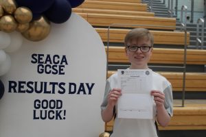 Cameron from Saint Edmund Arrowsmith with their GCSE results