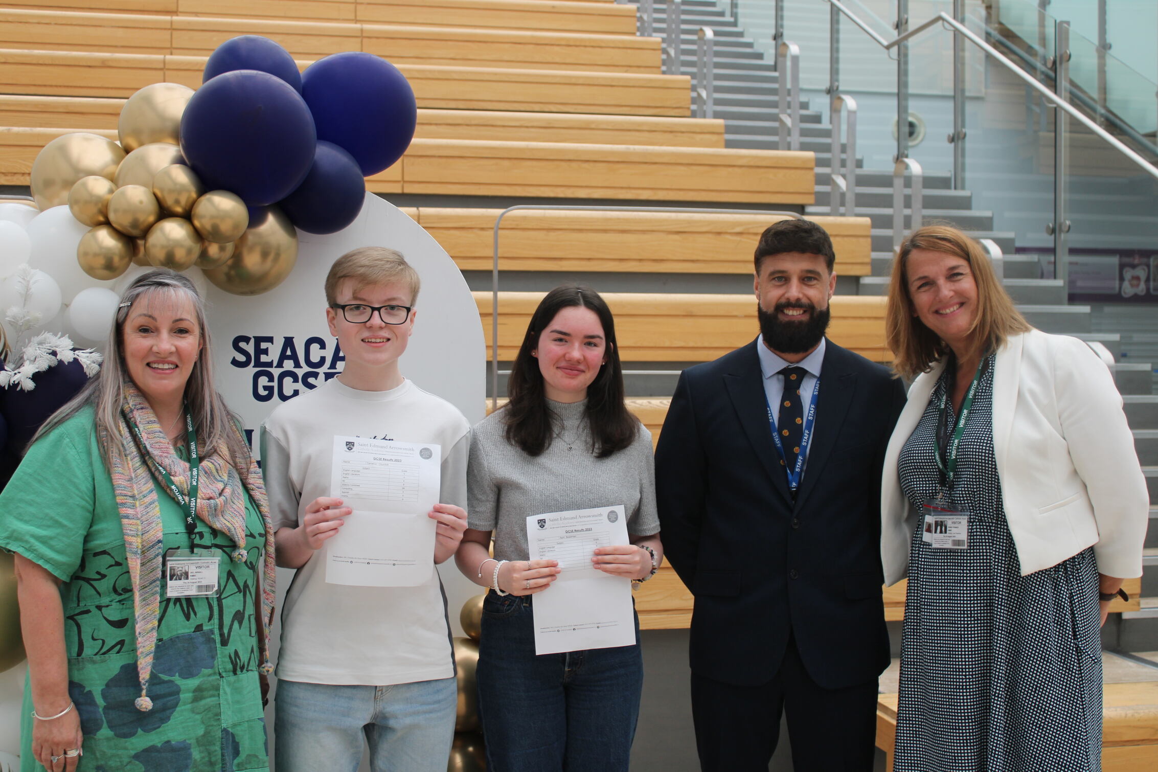 Head boy and head girl of St Edmund Arrowsmith stand with their results