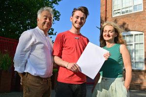 Head Boy of St Mary's Crosby, Xavier Cottrell-Boyce, pictured with his parents, will study Ancient and Medieval History at the University of Edinburgh.