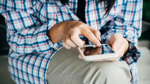 Person holding a mobile phone