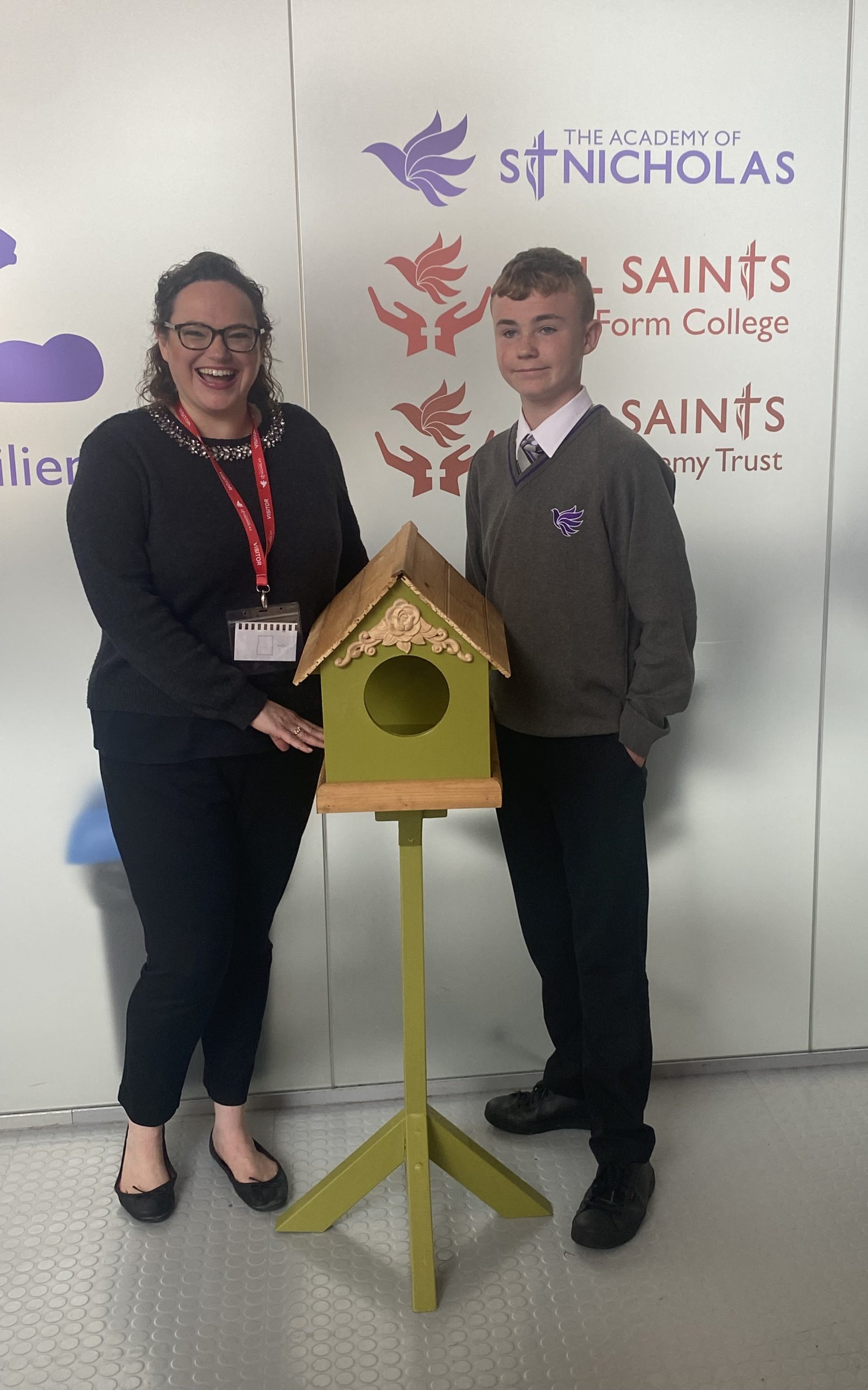 (Left) Kate Martinez from the Palm House with The Academy of St Nicholas student Cody (right) with his bird table