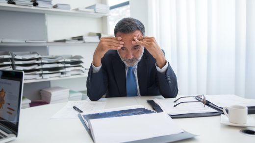 Man at desk stressed