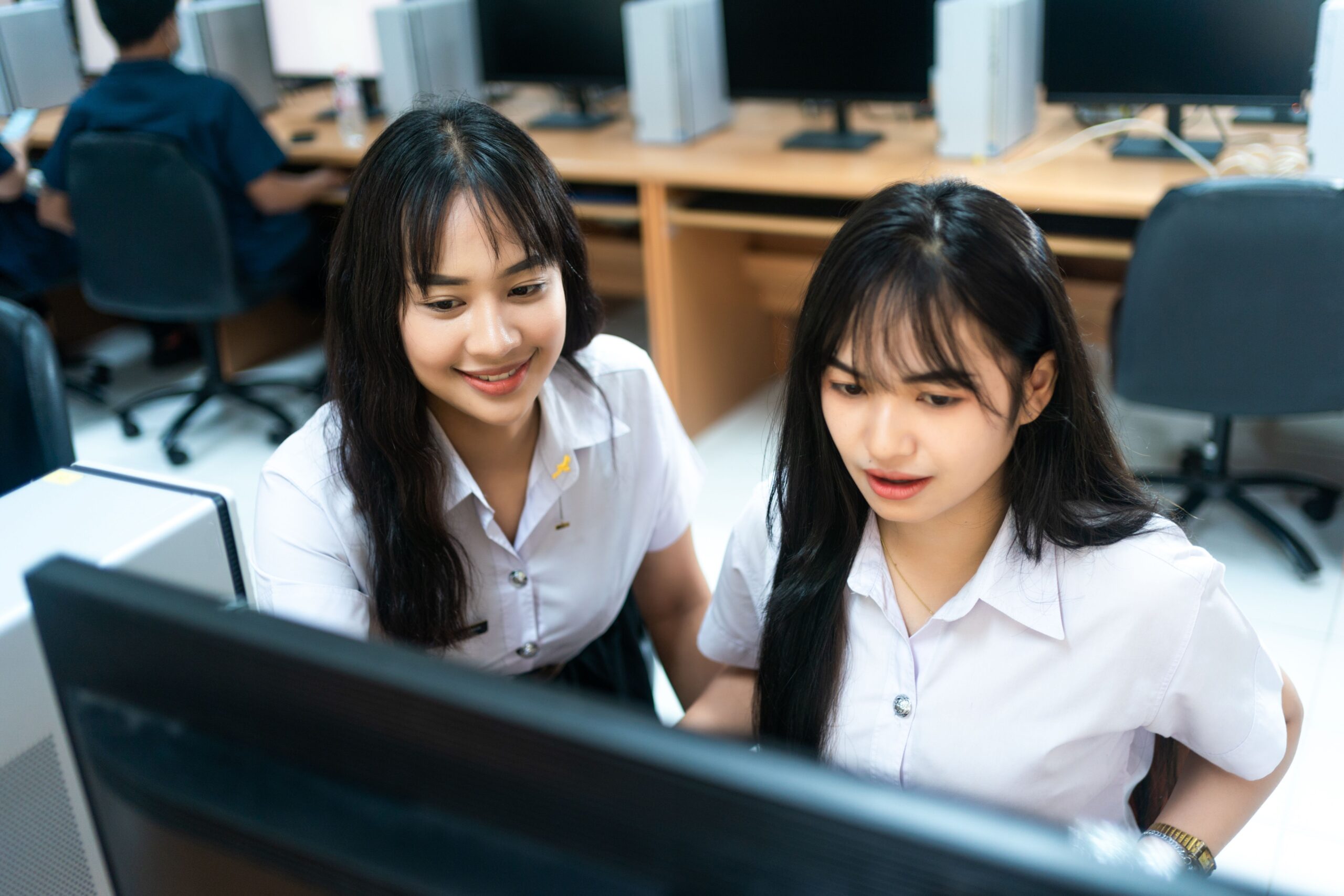 IT students sitting in-front- of computer