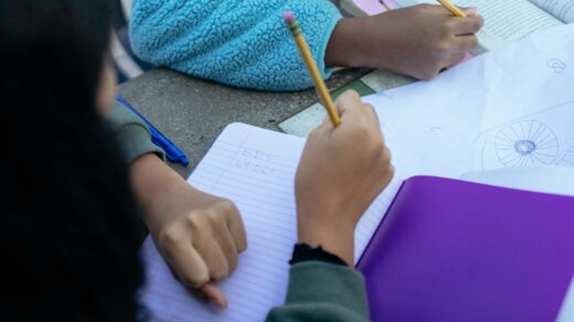 Children writing in books