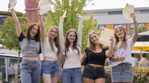 Carmel College A-level students holding results