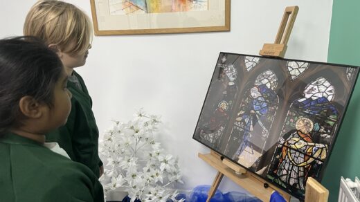 St Alban's pupils reflecting infront of the Jubilee Icon