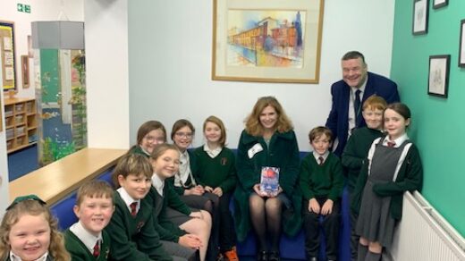 Samantha Giles with St Alban's headteacher Mr John McDonald and pupils